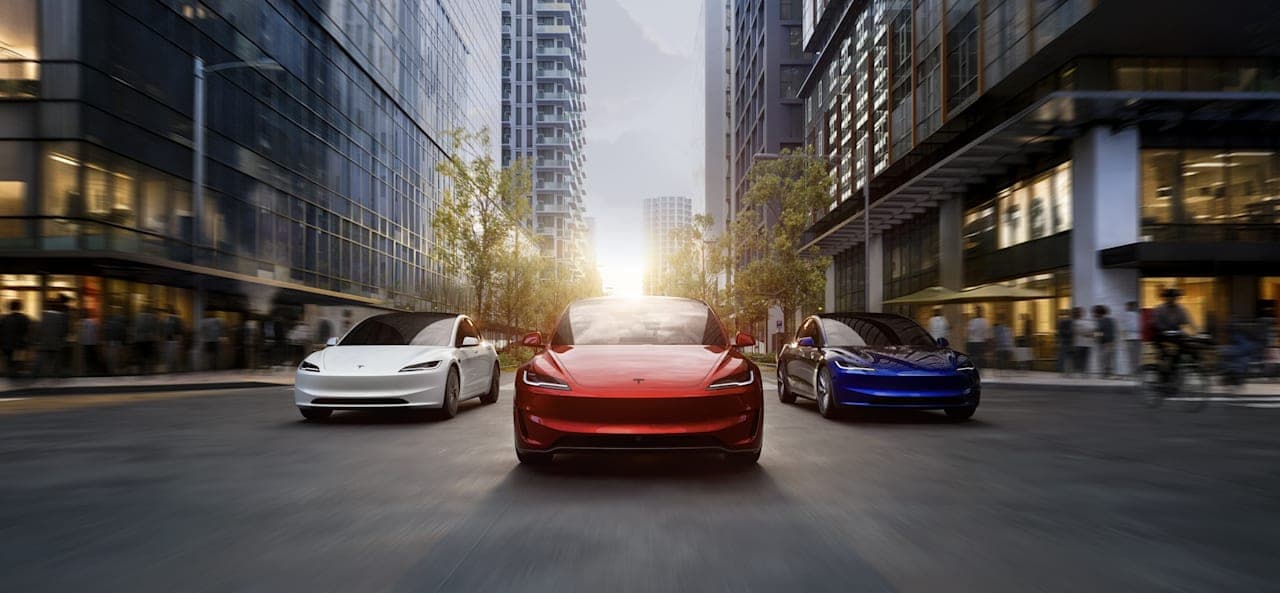 Tesla Model 3 vehicles on a city street